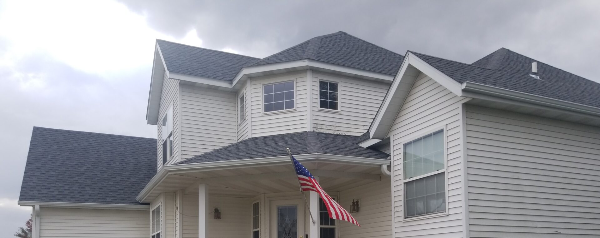 high-quality and complex roof with American flag in eastern iowa